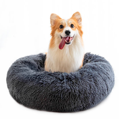 "Ultra-soft, fluffy pet bed designed for deep sleep and relaxation. Features a plush, round donut shape with cozy faux fur for warmth and comfort. Ideal for cats and small dogs to curl up and enjoy a restful sleep."